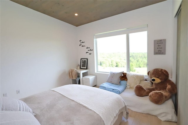 bedroom with hardwood / wood-style flooring