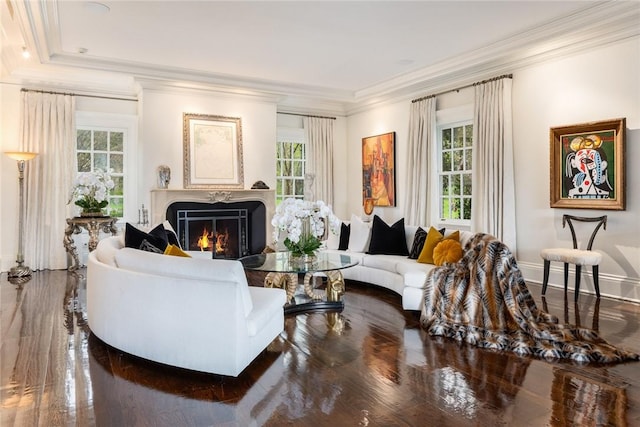 living room with hardwood / wood-style flooring and crown molding