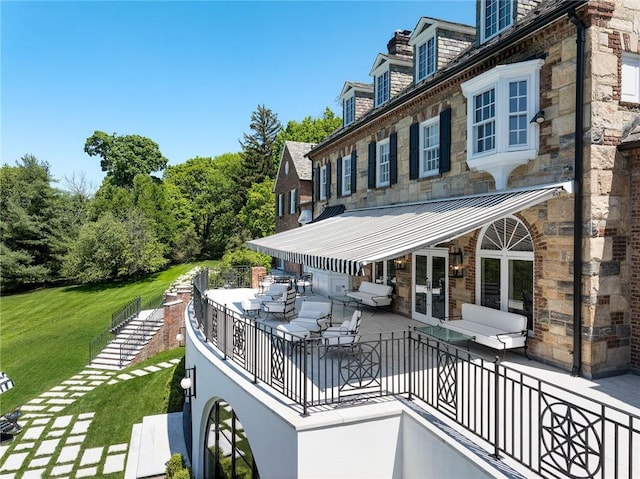 exterior space with outdoor lounge area, a patio area, and a yard