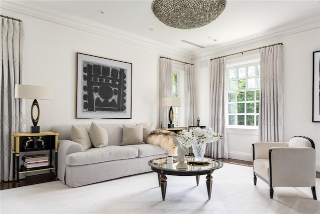 living room featuring hardwood / wood-style flooring and ornamental molding