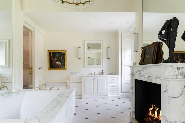 bathroom with vanity, crown molding, a bathtub, and a high end fireplace