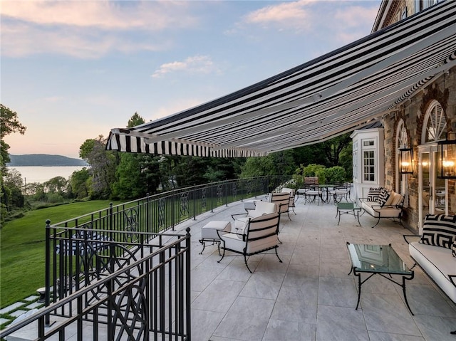 patio terrace at dusk with a lawn