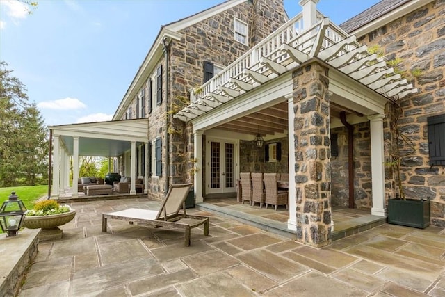 view of patio / terrace featuring an outdoor living space and a balcony