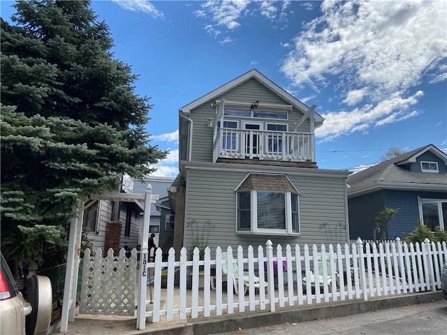 view of front of house featuring a balcony