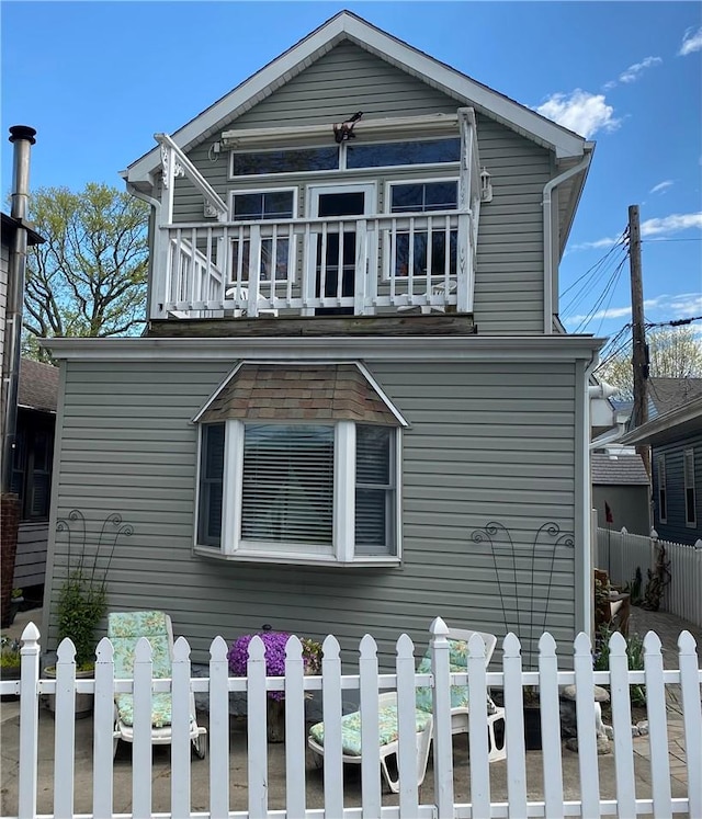 view of property exterior with a balcony