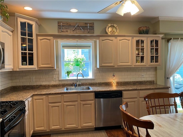 kitchen with wood-type flooring, stainless steel appliances, tasteful backsplash, and sink