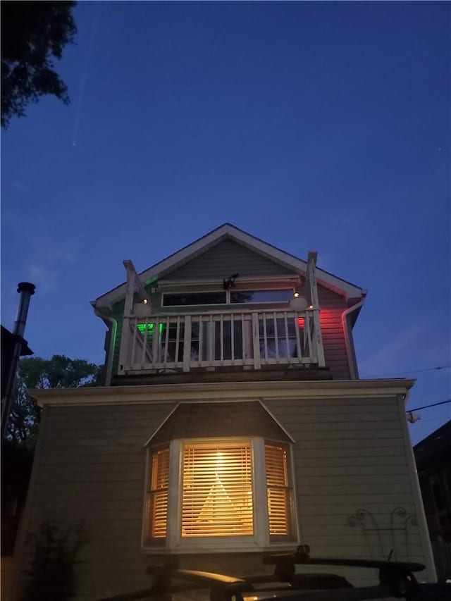 back of house with a balcony