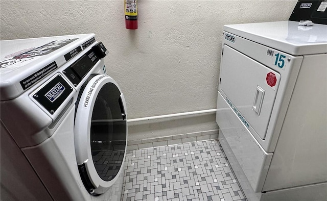 laundry room with separate washer and dryer