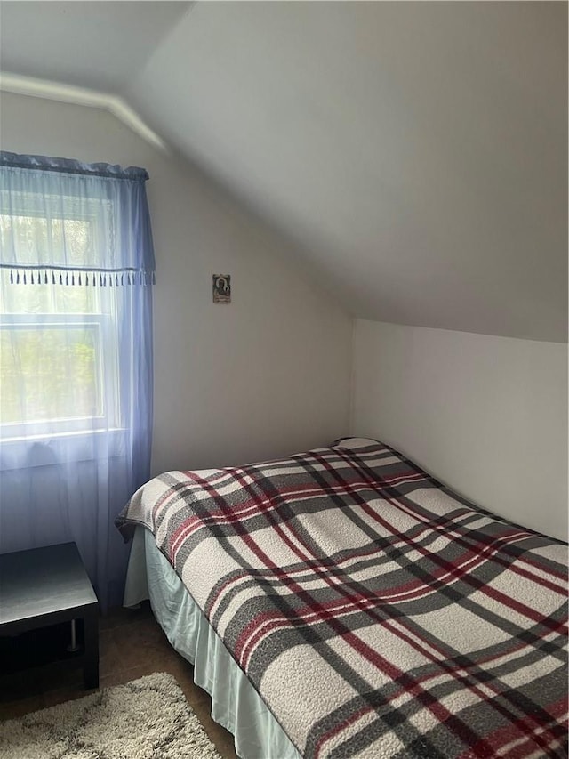 bedroom featuring vaulted ceiling