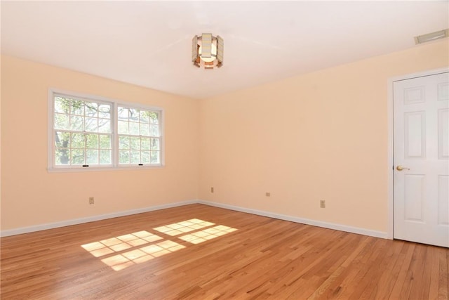 spare room featuring light hardwood / wood-style floors