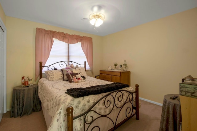 bedroom featuring carpet and baseboards