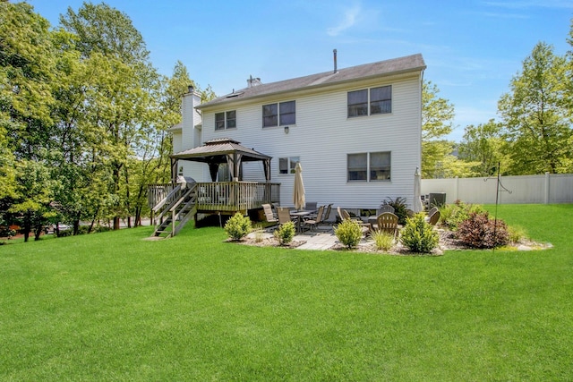 rear view of house featuring a gazebo, a chimney, and a patio