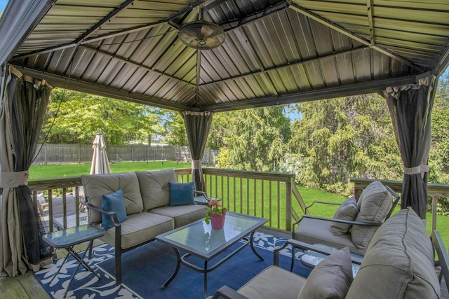 wooden terrace with outdoor lounge area and a gazebo