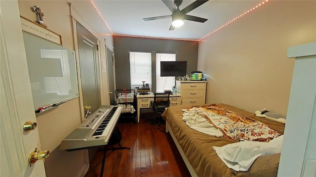 bedroom featuring ceiling fan and dark wood-type flooring