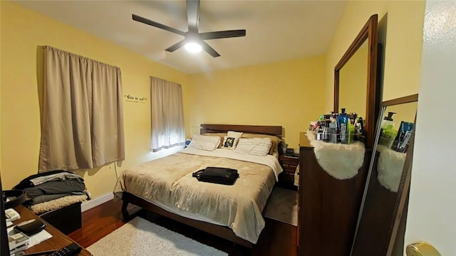 bedroom featuring dark hardwood / wood-style floors and ceiling fan