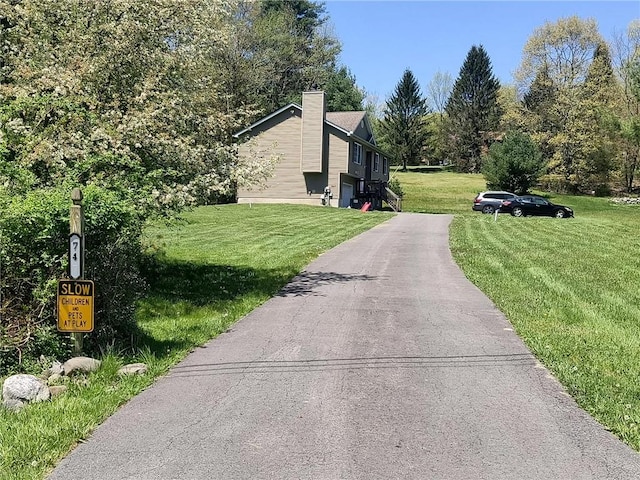 view of side of home featuring a lawn