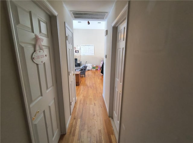 hallway featuring light hardwood / wood-style flooring