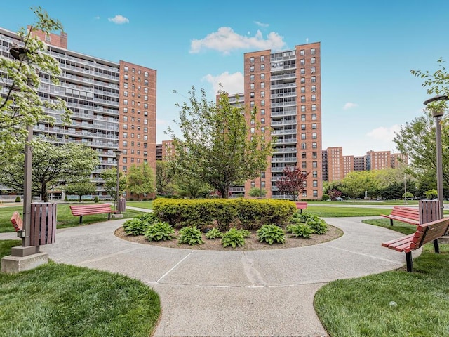 view of home's community featuring a lawn