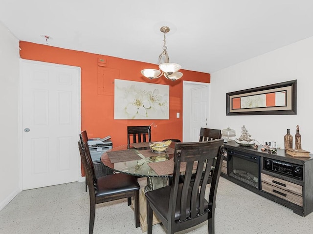 dining area with an inviting chandelier