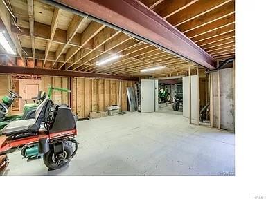 misc room with concrete flooring