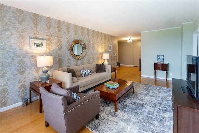 living room with light wood-type flooring and crown molding