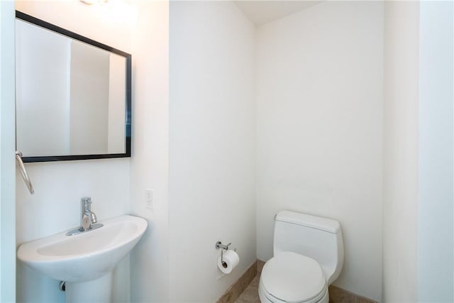 bathroom with toilet and sink