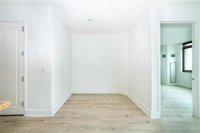 unfurnished room featuring light hardwood / wood-style flooring