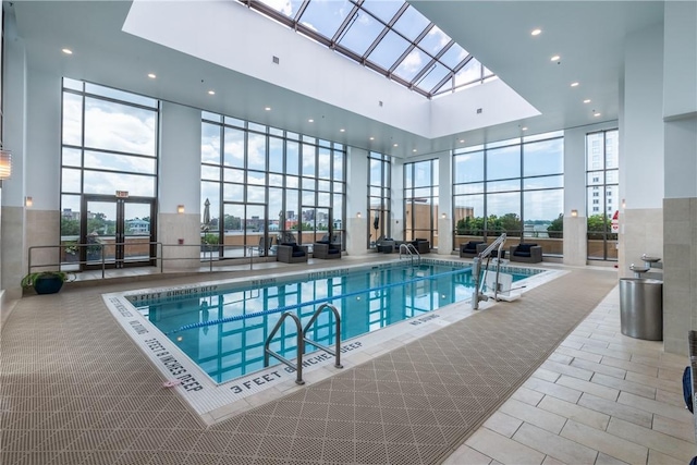 view of swimming pool with a skylight