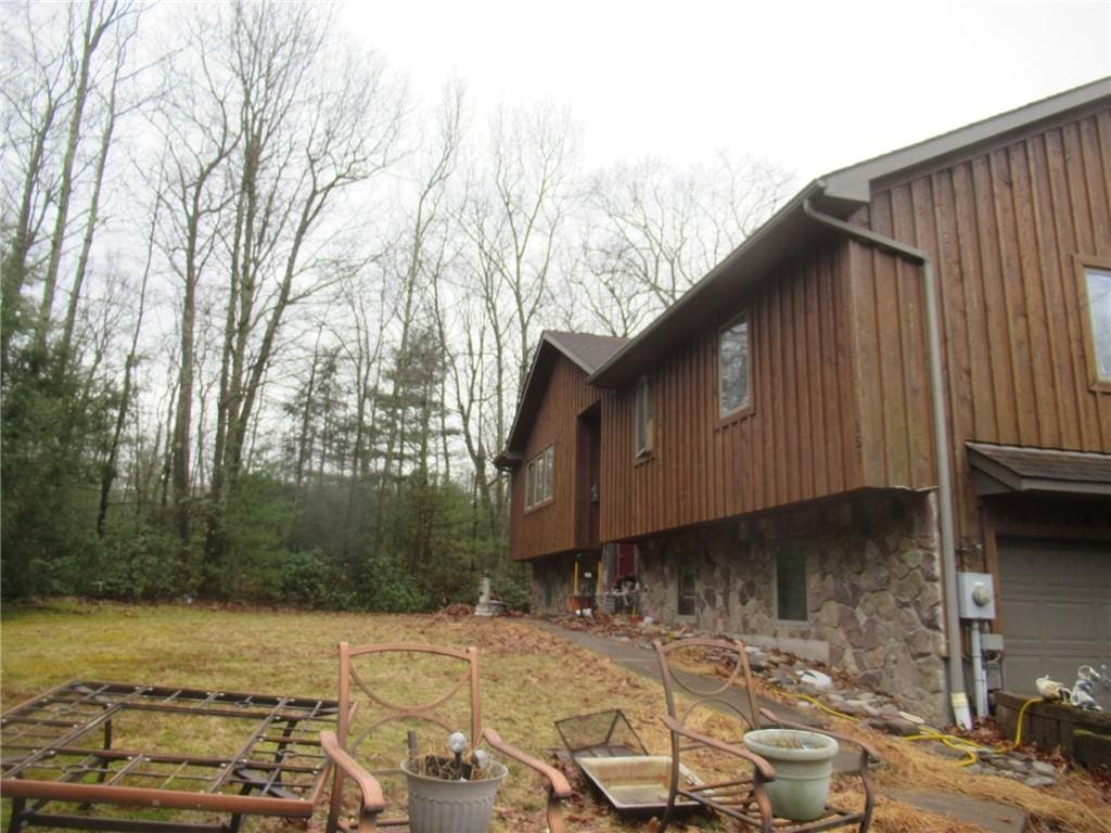 view of side of property featuring a garage