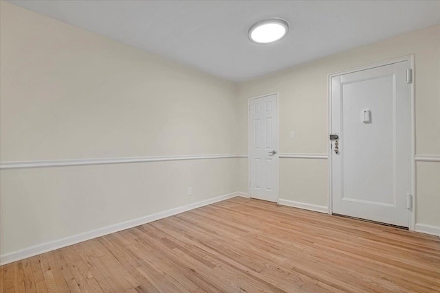 empty room with light wood-type flooring