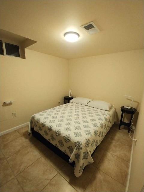 bedroom featuring tile patterned flooring