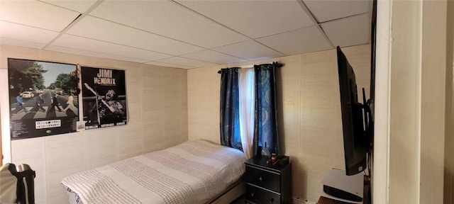 bedroom featuring a paneled ceiling