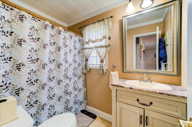 bathroom featuring tile patterned floors, vanity, toilet, and crown molding