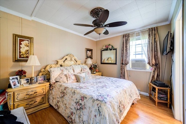 bedroom with ceiling fan, light hardwood / wood-style floors, ornamental molding, and cooling unit