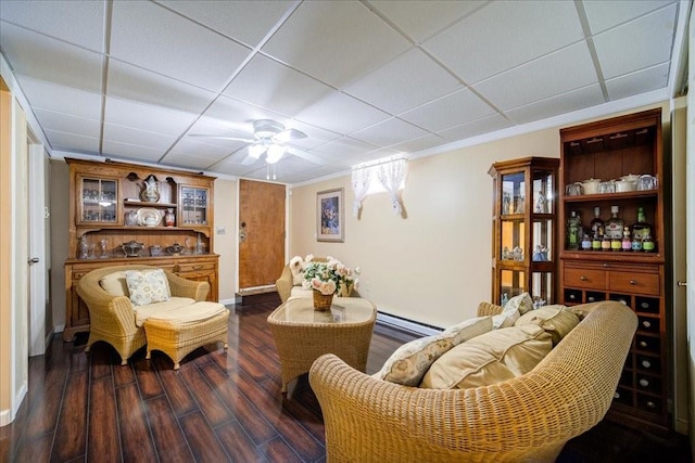 307 Beaver Lake Rd, Livingston Manor, NY 12758 - living room with a baseboard heating unit, dark wood-style floors, ceiling fan, and a paneled ceiling