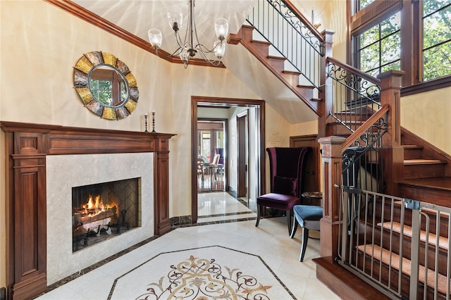 33 Livingston Ave, Dobbs Ferry, NY 10522 - living area featuring plenty of natural light, a fireplace, a chandelier, stairs, and ornamental molding