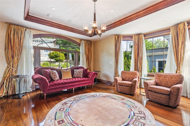 33 Livingston Ave, Dobbs Ferry, NY 10522 - living room featuring hardwood / wood-style floors, a raised ceiling, a chandelier, crown molding, and baseboards