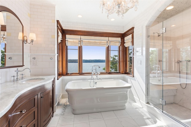 33 Livingston Ave, Dobbs Ferry, NY 10522 - full bath with a chandelier, a freestanding bath, vanity, a shower stall, and marble finish flooring