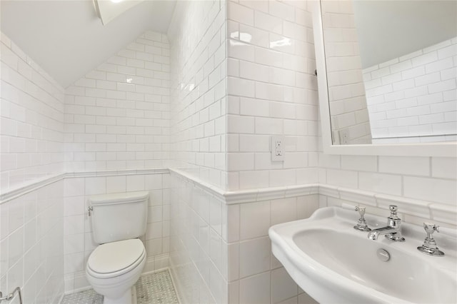 33 Livingston Ave, Dobbs Ferry, NY 10522 - bathroom with tile walls, a sink, vaulted ceiling, and toilet