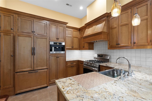 33 Livingston Ave, Dobbs Ferry, NY 10522 - kitchen with a sink, stainless steel gas stove, brown cabinetry, backsplash, and pendant lighting