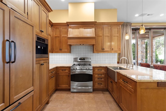 33 Livingston Ave, Dobbs Ferry, NY 10522 - kitchen with stainless steel range with gas cooktop, paneled built in refrigerator, a sink, brown cabinetry, and a peninsula
