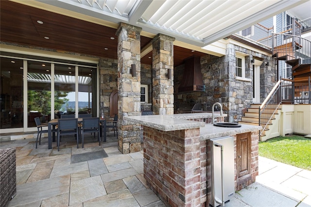 33 Livingston Ave, Dobbs Ferry, NY 10522 - view of patio featuring stairway, an outdoor bar, an outdoor kitchen, and outdoor dining space