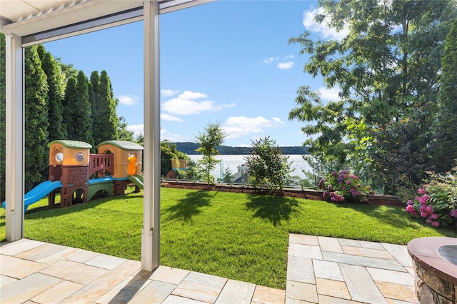 33 Livingston Ave, Dobbs Ferry, NY 10522 - view of green lawn featuring a playground, a water view, and a patio