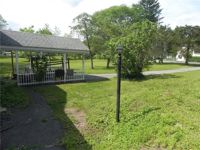 view of property's community featuring a gazebo and a lawn