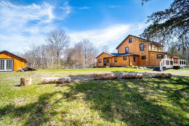 view of yard with an outbuilding and a wooden deck