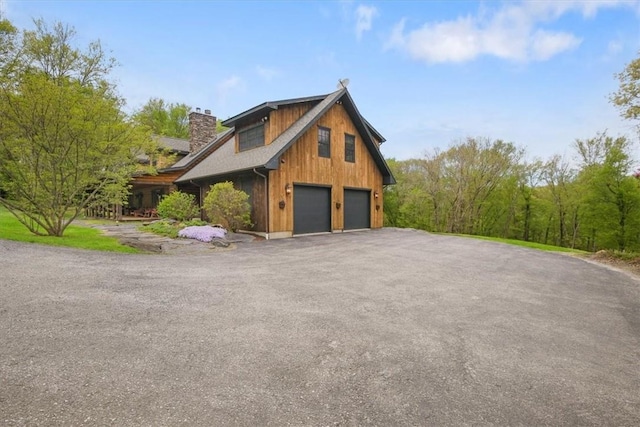 view of property exterior with a garage