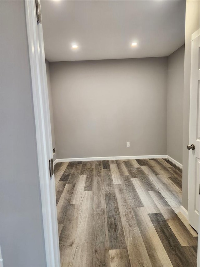 empty room with hardwood / wood-style floors