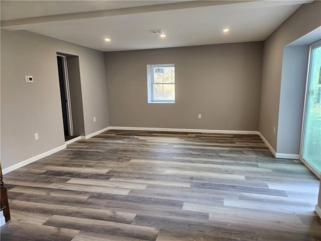 spare room featuring dark hardwood / wood-style floors