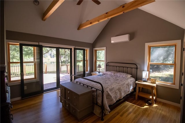 bedroom with multiple windows, a wall mounted AC, and dark hardwood / wood-style floors