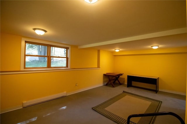 basement featuring a baseboard heating unit